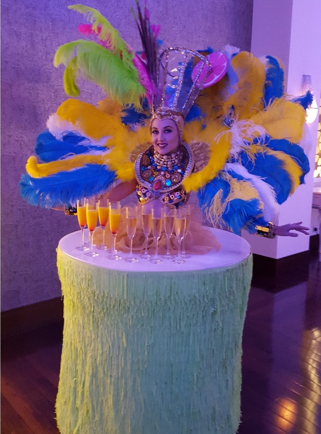 Green and Blue Feather Strolling Table Lady