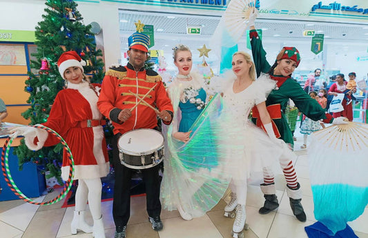 Red and white Christmas Parade with drummers and hula hoops