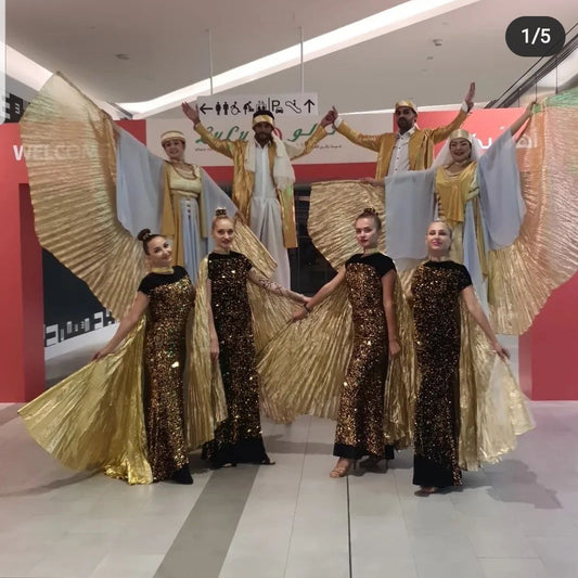 Golden Colour Stilt Walker and Wings dancers by Fidelio Arts