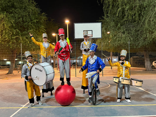 Acrobat Juggler with drummers and stilt walker parade