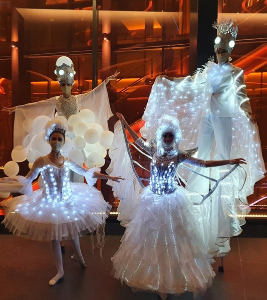 LED White Parade With Stilt Walker