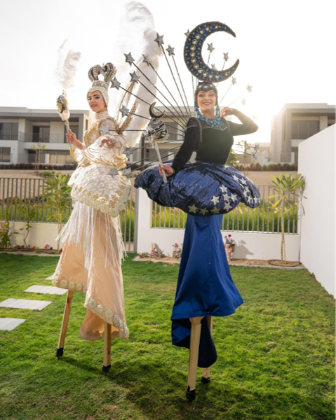 Moon Star and White Masquerade Stilt Walkers