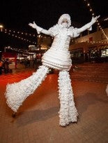 White snowball Stilt Walker