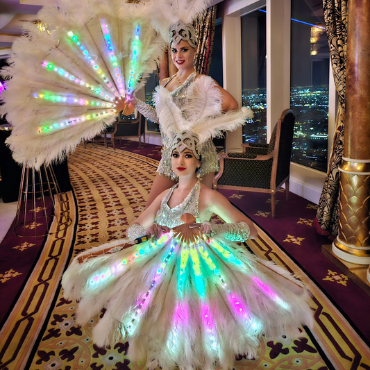 White Feather Dancers and Hostess by Fidelio Arts